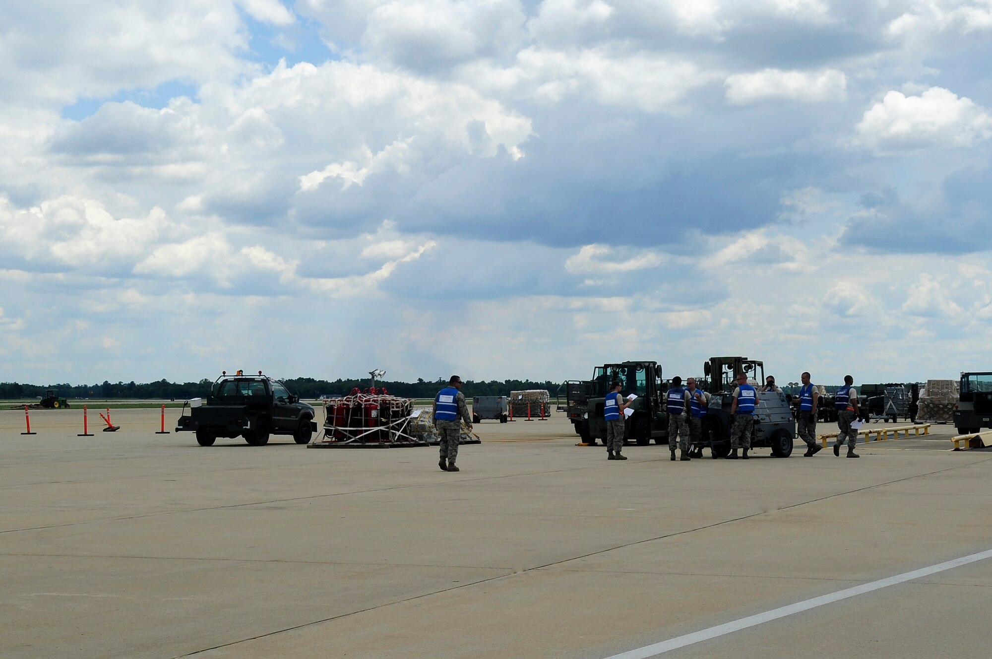 U.S. Air Force Airmen retain and organize cargo on the flight line during an Operational Readiness Exercise at Shaw Air Force Base, S.C., May 21, 2012. An ORE evaluates the 20th Fighter Wing's ability to meet wartime and contingency tasks. (U.S. Air Force photo by Airman 1st Class Hunter Brady/Released)