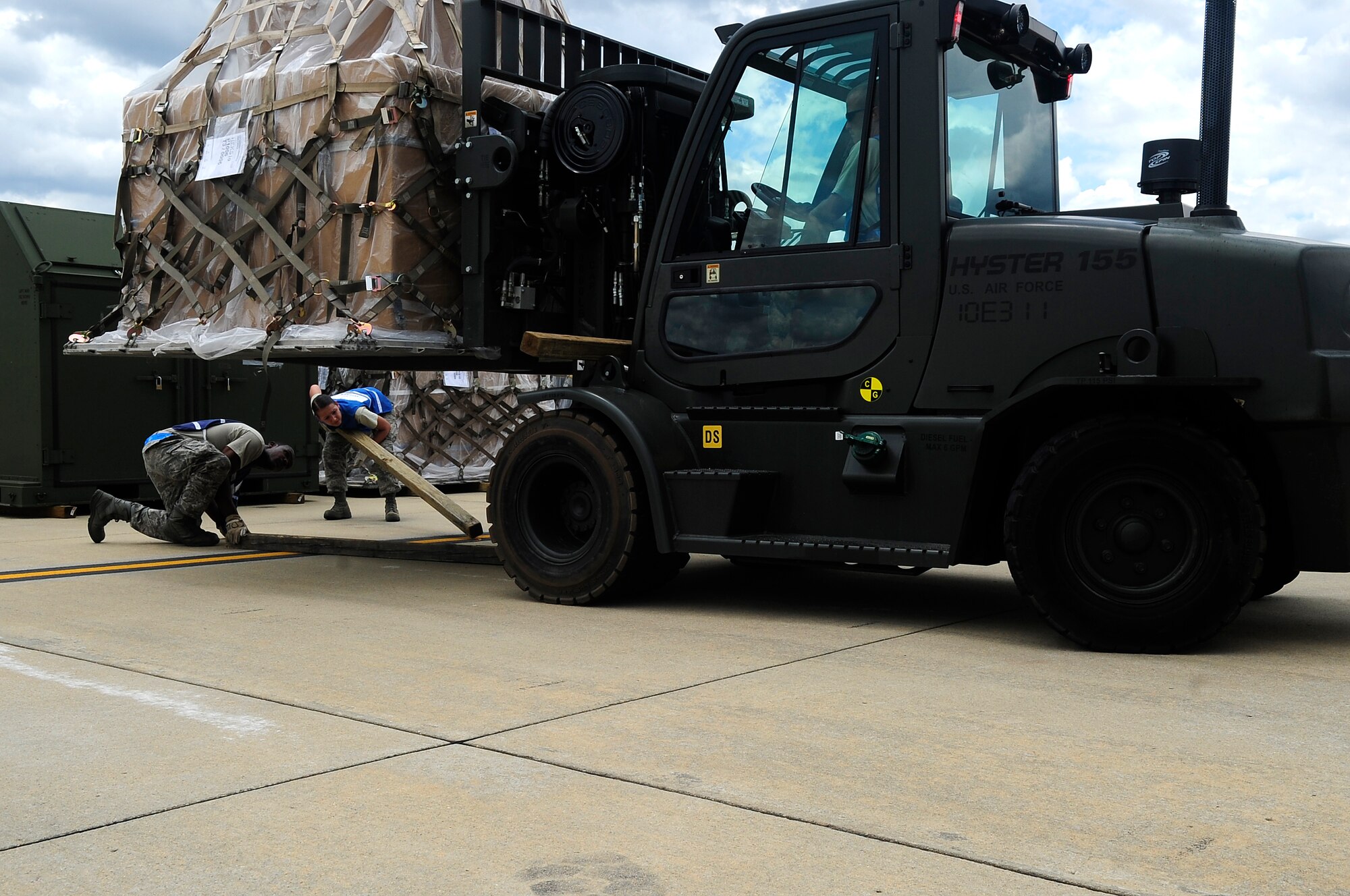 U.S. Air Force Airmen move cargo to designated points during an Operational Readiness Exercise at Shaw Air Force Base, S.C., May 21, 2012. An ORE evaluates the 20th Fighter Wing's ability to meet wartime and contingency tasks. (U.S. Air Force photo by Airman 1st Class Hunter Brady/Released)