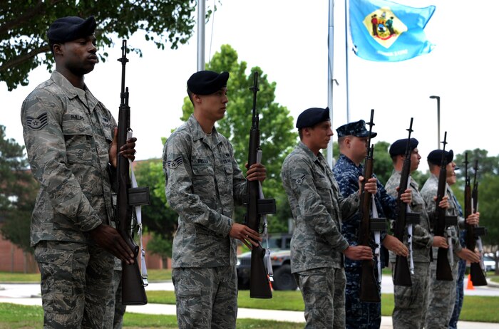 Airmen from the 628th Security Forces Squadron stand ready to render the 21 gun salute during the “National Police Week” retreat ceremony May 18, 2012 at Joint Base Charleston, S.C. During National Police Week, Security Forces members honor law enforcement personnel who have fallen.  Joint Base Charleston held other activities and events for Police Week to include a ‘Guns and Hoses’ competition against the 628th Civil Engineer Squadron and a Chili Cook Off. (U.S. Air Force photo/Airman 1st Class Ashlee Galloway)