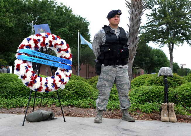 Senior Airman Matthew Valverde, 628th Security Forces Squadron, stands at parade rest during the “National Police Week” retreat ceremony May 18, 2012 at Joint Base Charleston, S.C. During National Police Week, Security Forces members honor law enforcement personnel who have fallen.  In 1962, President John F. Kennedy signed a proclamation which designated May 15th as Peace Officers Memorial Day and the week in which the date falls as Police Week. (U.S. Air Force photo/Airman 1st Class Ashlee Galloway)