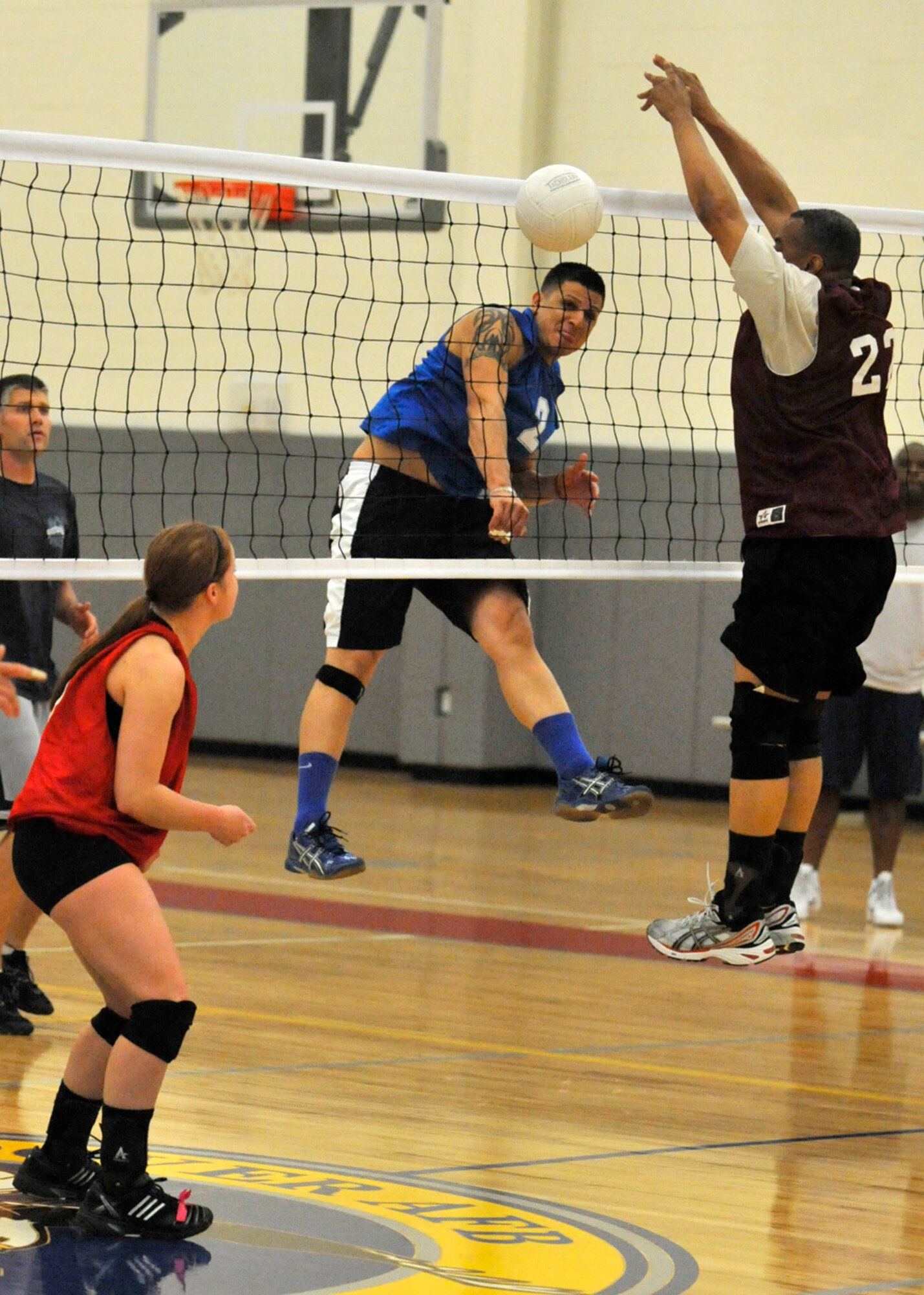 Fermin Rodriguez, 736th Aircraft Maintenance Squadron, slams home a kill against the 436th Aerial Port Squadron A team during the semifinal volleyball match May 21, 2012, at the Fitness Center on Dover Air Force Base, Del. Rodriguez helped lead the 736th AMXS into the championship match with a 26-24, 21-25 and 15-11 victory against the 436th APS A team. (U.S. Air Force photo by Tech. Sgt. Chuck Walker)