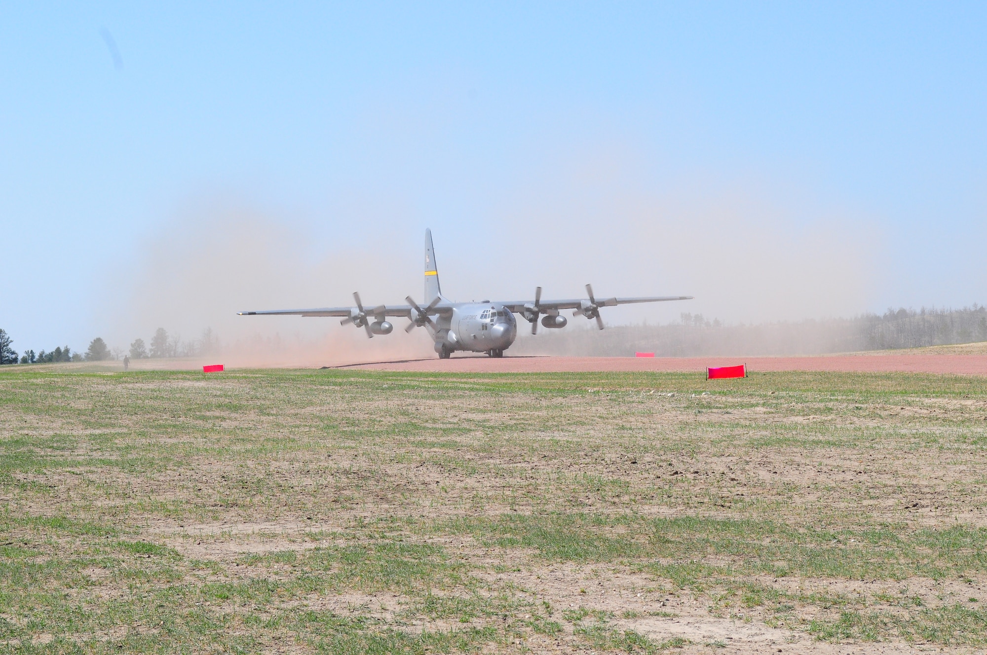 A Wyoming Air National Guard C-130 Hercules, assigned to the 153rd Airlift Wing, becomes the first to test the new Lt. Gen. Wright Tactical Airfield at the Camp Guernsey Joint Training Center's North Training Area, May 15, 2012. The airfield concept for Camp Guernsey was conceived 20 years ago and will provide aircrews real-world tactical training in coordination with ground combat forces. (Photo by Dewey Baars)