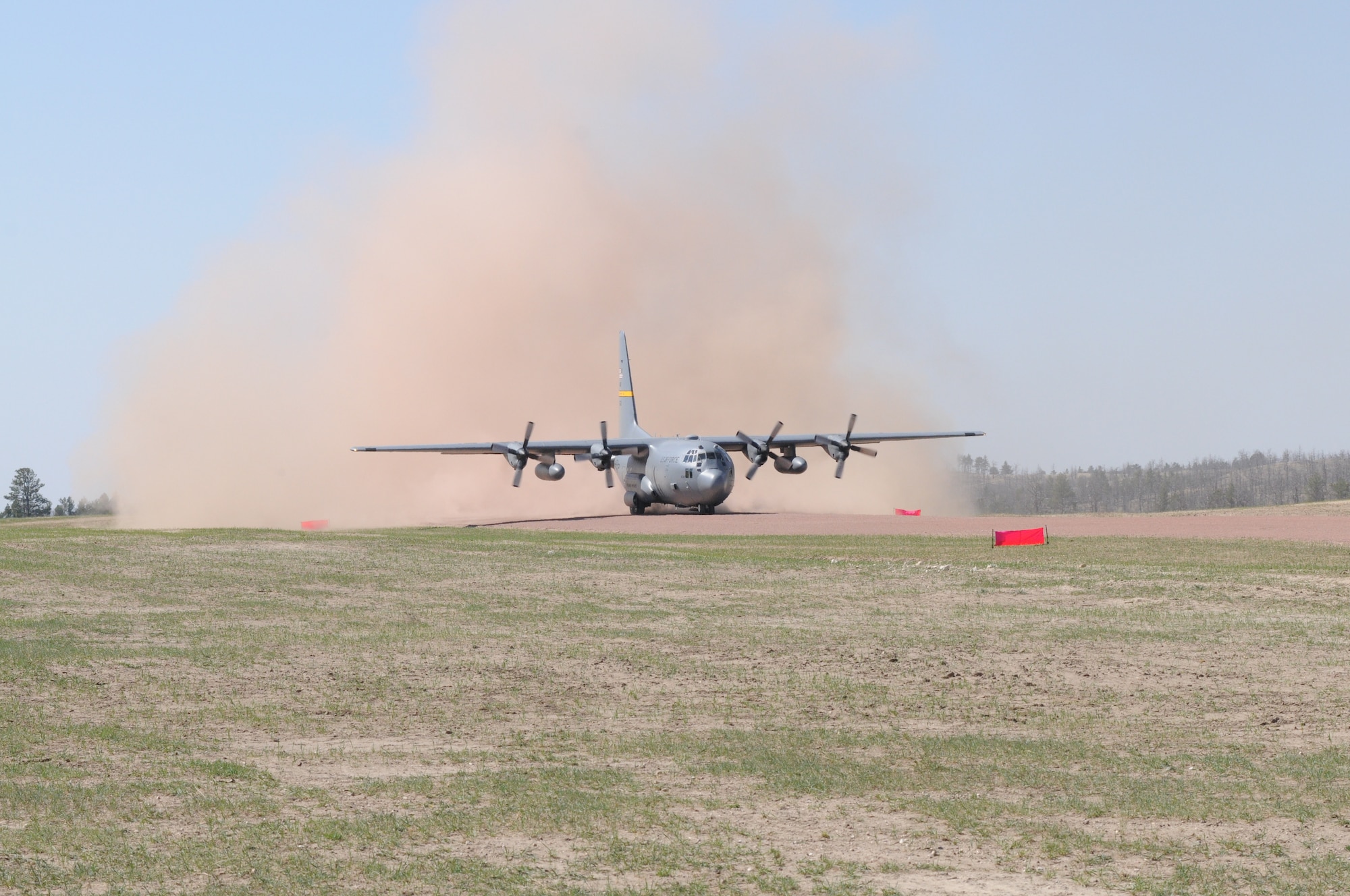 A Wyoming Air National Guard C-130 Hercules, assigned to the 153rd Airlift Wing, becomes the first to test the new Lt. Gen. Wright Tactical Airfield at the Camp Guernsey Joint Training Center's North Training Area, May 15, 2012. The airfield concept for Camp Guernsey was conceived 20 years ago and will provide aircrews real-world tactical training in coordination with ground combat forces. (Photo by Dewey Baars)