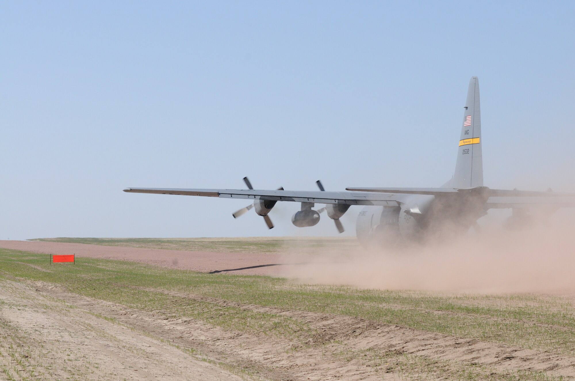 A Wyoming Air National Guard C-130 Hercules, assigned to the 153rd Airlift Wing, becomes the first to test the new Lt. Gen. Wright Tactical Airfield at the Camp Guernsey Joint Training Center's North Training Area, May 15, 2012. The airfield concept for Camp Guernsey was conceived 20 years ago and will provide aircrews real-world tactical training in coordination with ground combat forces. (Photo by Dewey Baars)