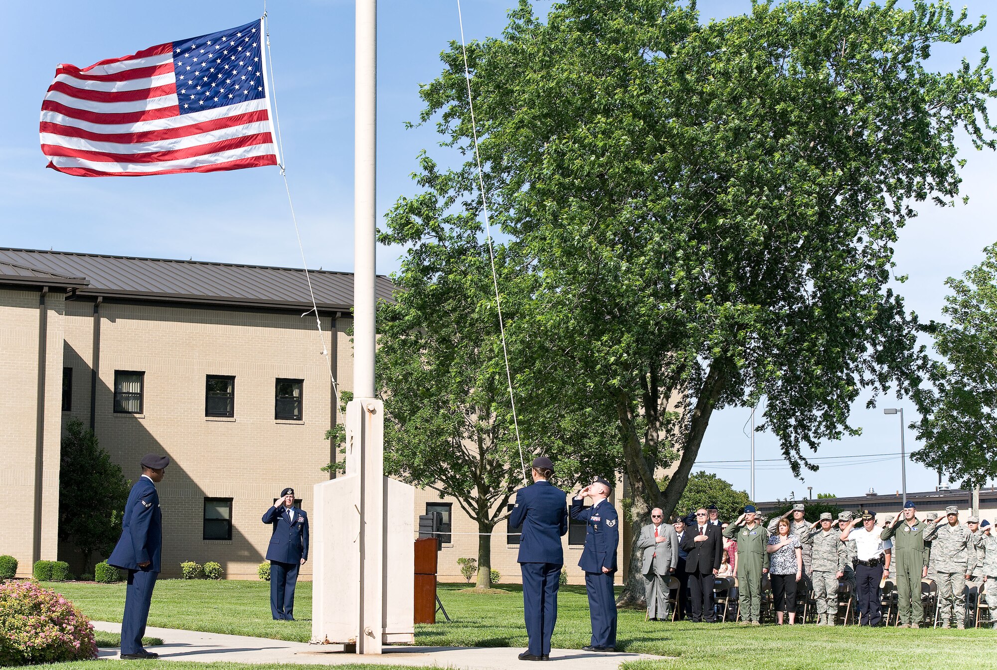 A 436th Security Forces Squadron flag-detail lowers the U.S. Flag during a retreat ceremony May 18, 2012, at Dover Air Force Base, Del. National Police Week culminated with the observance of the retreat ceremony. (U.S. Air Force photo by Roland Balik)

