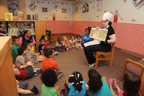 Janet Trevino, 902nd Force Support Squadron librarian, reads stories to the children from the Joint Base San Antonio-Randolph Child Development Center May 18 at the JBSA-Randolph library for the kick off of the summer reading program.  (U.S. Air Force photo by Rich McFadden) 
