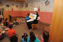 Janet Trevino, 902nd Force Support Squadron librarian, reads stories to the children from the Joint Base San Antonio-Randolph Child Development Center May 18 at the JBSA-Randolph library for the kick off of the summer reading program.  (U.S. Air Force photo by Rich McFadden) 
