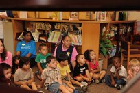 Children from the Joint Base San Antonio-Randolph Child Development Center listen to the reading program May 18 at the JBSA-Randolph library for the kick off of the summer reading program.  (U.S. Air Force photo by Rich McFadden) 