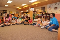 Children from the Joint Base San Antonio-Randolph Child Development Center listen to the reading program at the JBSA-Randolph library May 18 for the kick off of the summer reading program. (U.S. Air Force photo by Rich McFadden) 