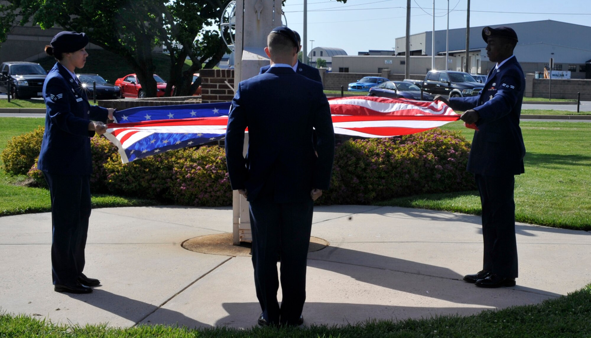 Members of the 436th Security Forces Squadron fold the flag during a retreat ceremony May 18, 2012, on Dover Air Force Base, Del. The retreat was in commemoration of National Police Week. (U.S. Air Force photo by Tech. Sgt. Chuck Walker)