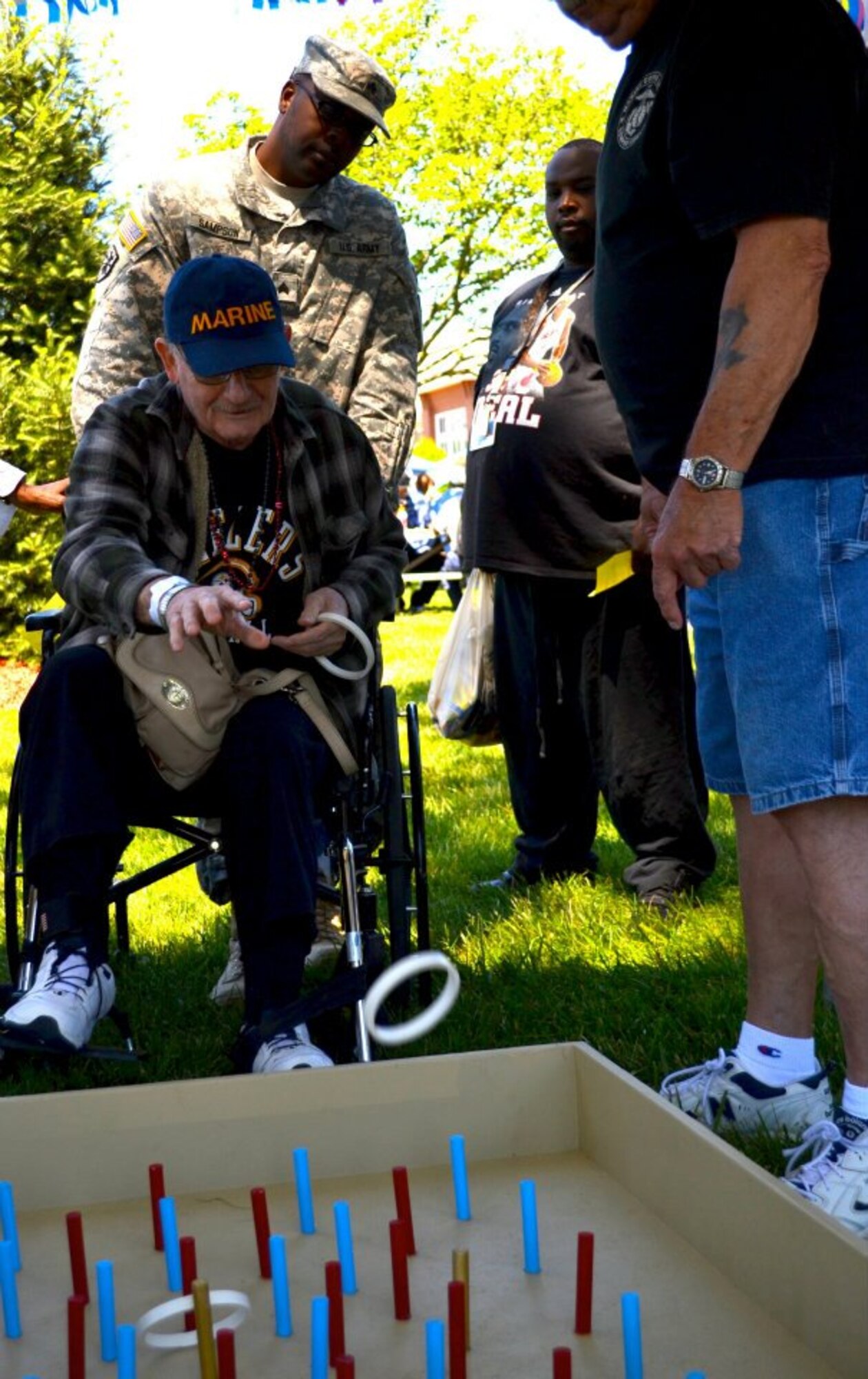Soldiers from the 7th Sustainment Brigade visit local veterans at the Veterans Affairs Medical Center in Hampton, Va., May 9, 2012. The Soldiers 'buddied up' with local veterans, volunteers and patients alike during a county fair hosted by the medical center. (U.S. Army photo by Sgt. Edwin Rodriguez/Released)