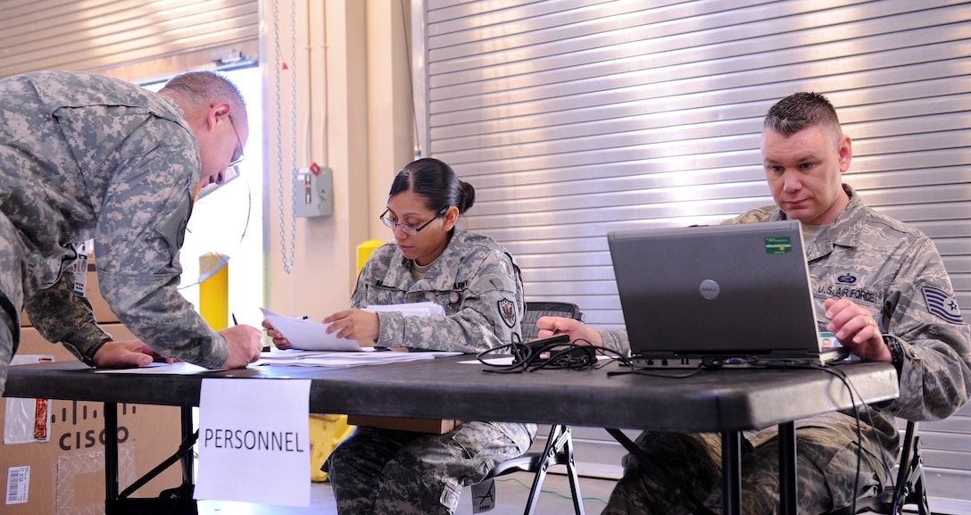 U.S. Army Staff Sgt. Elsie Muniz and U.S Air Force Tech. Sgt. Stephen Hall assess deployment readiness of Joint Task Force Civil Support personnel during a semi-annual personnel readiness exercise at Fort Eustis, Va., May 10-11, 2012. JTF-CS anticipates, plans and integrates U.S. Northern Command’s chemical, biological, radiological and nuclear response operations. (U.S. Army photo by Sgt. Ida Irby/Released)