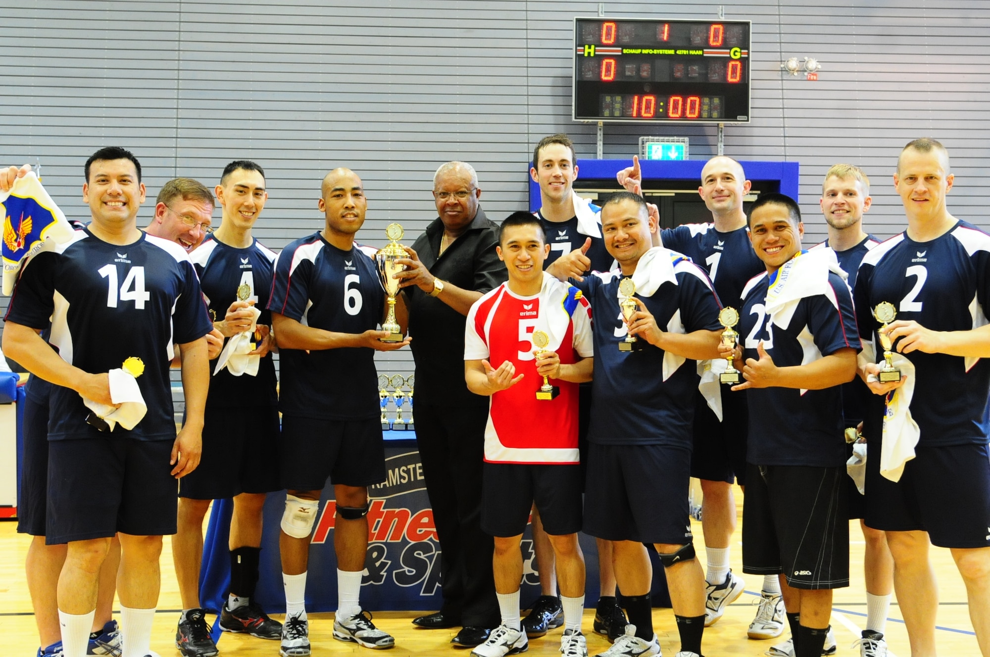 The Ramstein men’s volleyball team poses with their championship trophy. Ramstein won the championship title during the 2012 U.S. Forces in Europe Volleyball Championship held at the South Side fitness center here May 20. (U.S. Air Force photo/Airman 1st Class Hailey Haux)