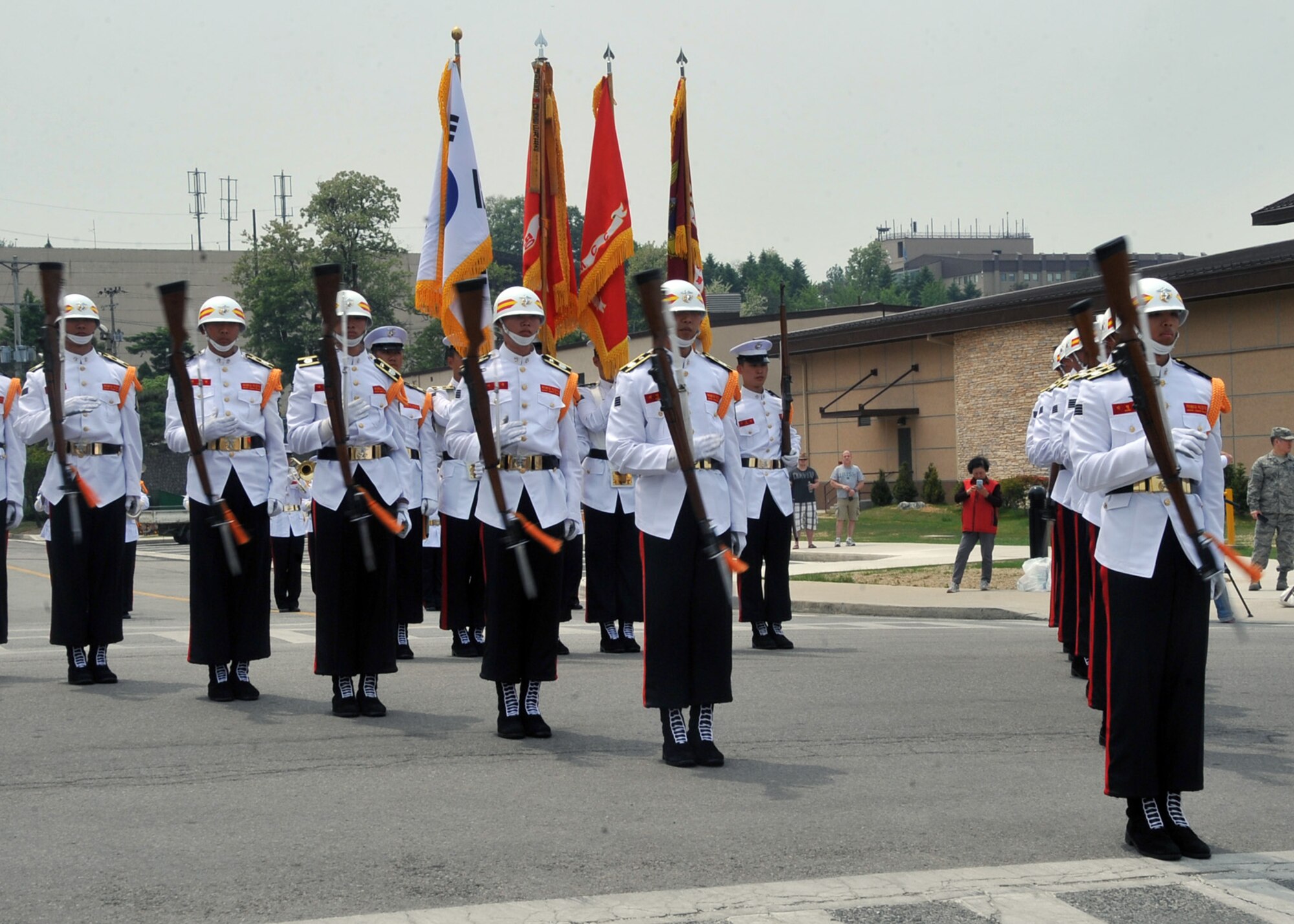 The Republic of Korea Marine Drill Team performs in front of the grand stand during the 2012 Armed Forces Day parade at Osan Air Base, Republic of Korea, May 19, 2012. More than 800 participants from 40 different organizations encompassing the 51st Fighter Wing, 7th Air Force, 8th Army Band, and Republic of Korea Marine Band and Drill Team marched in the parade that honors Americans in uniform who served their country in times of war and peace. (U.S. Air Force photo/Staff Sgt. Craig Cisek)