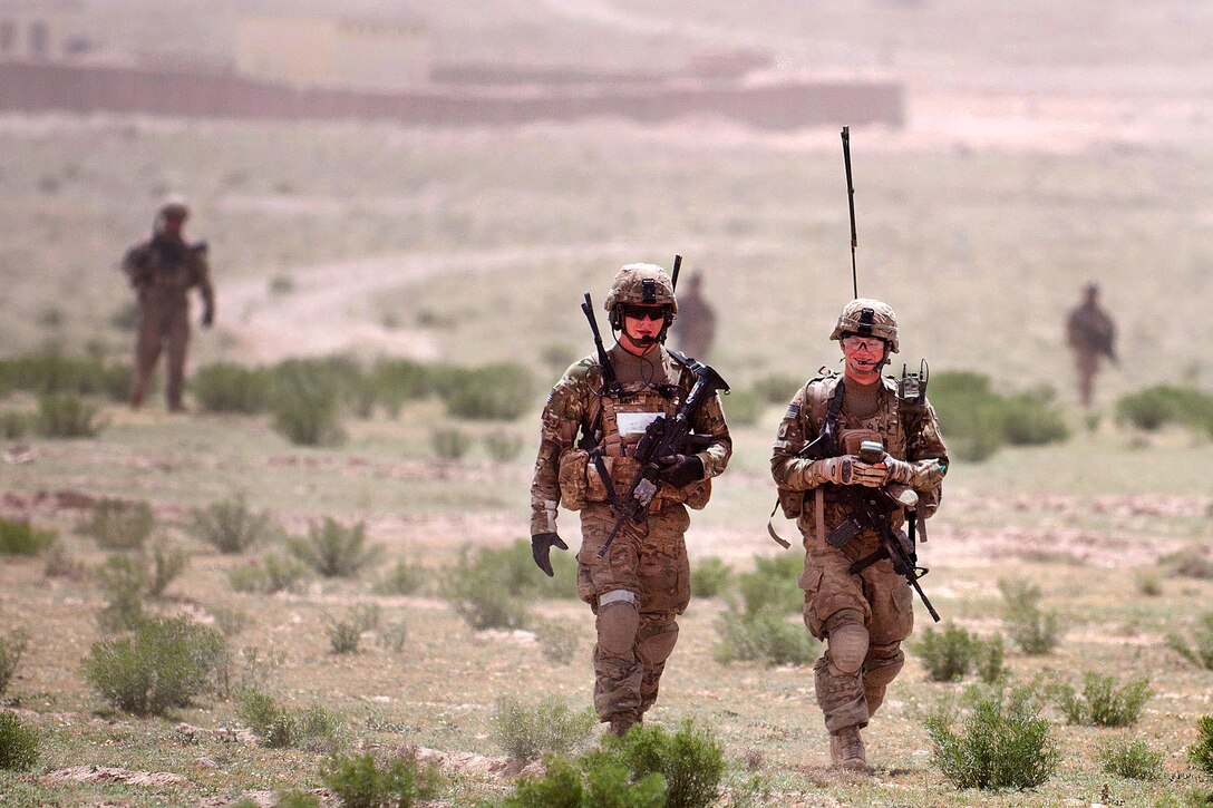 U.S. Army Sgt. Eric Bast, left, and fellow paratroopers leave Combat Outpost Giro on a patrol in Afghanistan's Ghazni province, May 17, 2012. Bast is assigned to the 82nd Airborne Division’s 1st Brigade Combat Team. Their platoon has made contact with the enemy during each of the last six patrols.