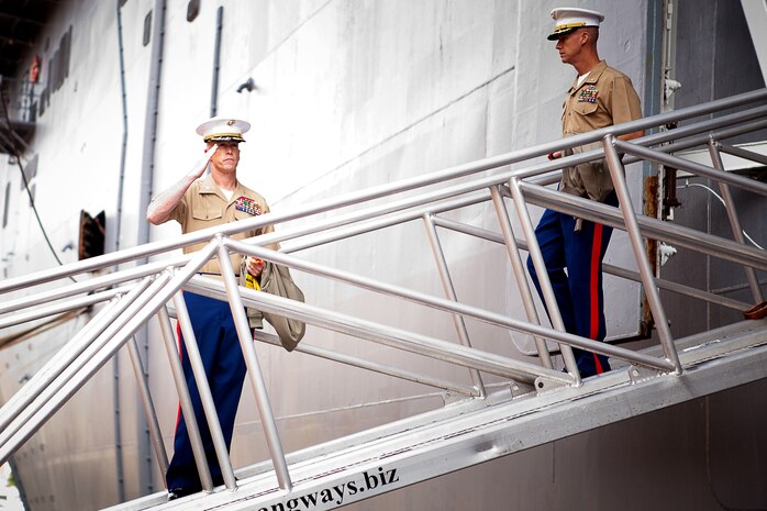 Col. Kenneth D. Enzor (left) shares a laugh and a handshake with Maj. Gen. Michael G. Dana, the commanding general of 2nd Marine Logistics Group, during Enzor’s retirement ceremony aboard Camp Lejeune, N.C., May 23, 2012. Enzor began his military career in 1974 when he enlisted in the U.S. Army. (U.S. Marine Corps photo by Staff Sgt. Justin J. Shemanski)