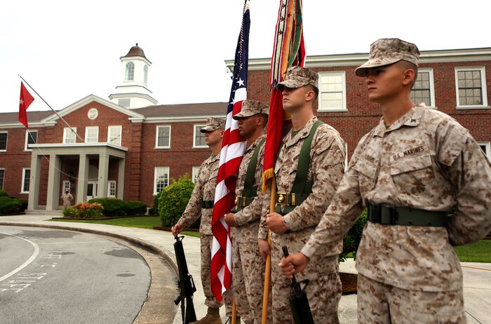 The 2nd Marine Logistics Group Color Guard awaits the start of Col. Kenneth D. Enzor’s retirement ceremony aboard Camp Lejeune, N.C., May 23, 2012. Enzor served as the chief of staff for 2nd Marine Logistics Group and began his military career in the U.S. Army more than three decades ago. (U.S. Marine Corps photo by Staff Sgt. Justin J. Shemanski)