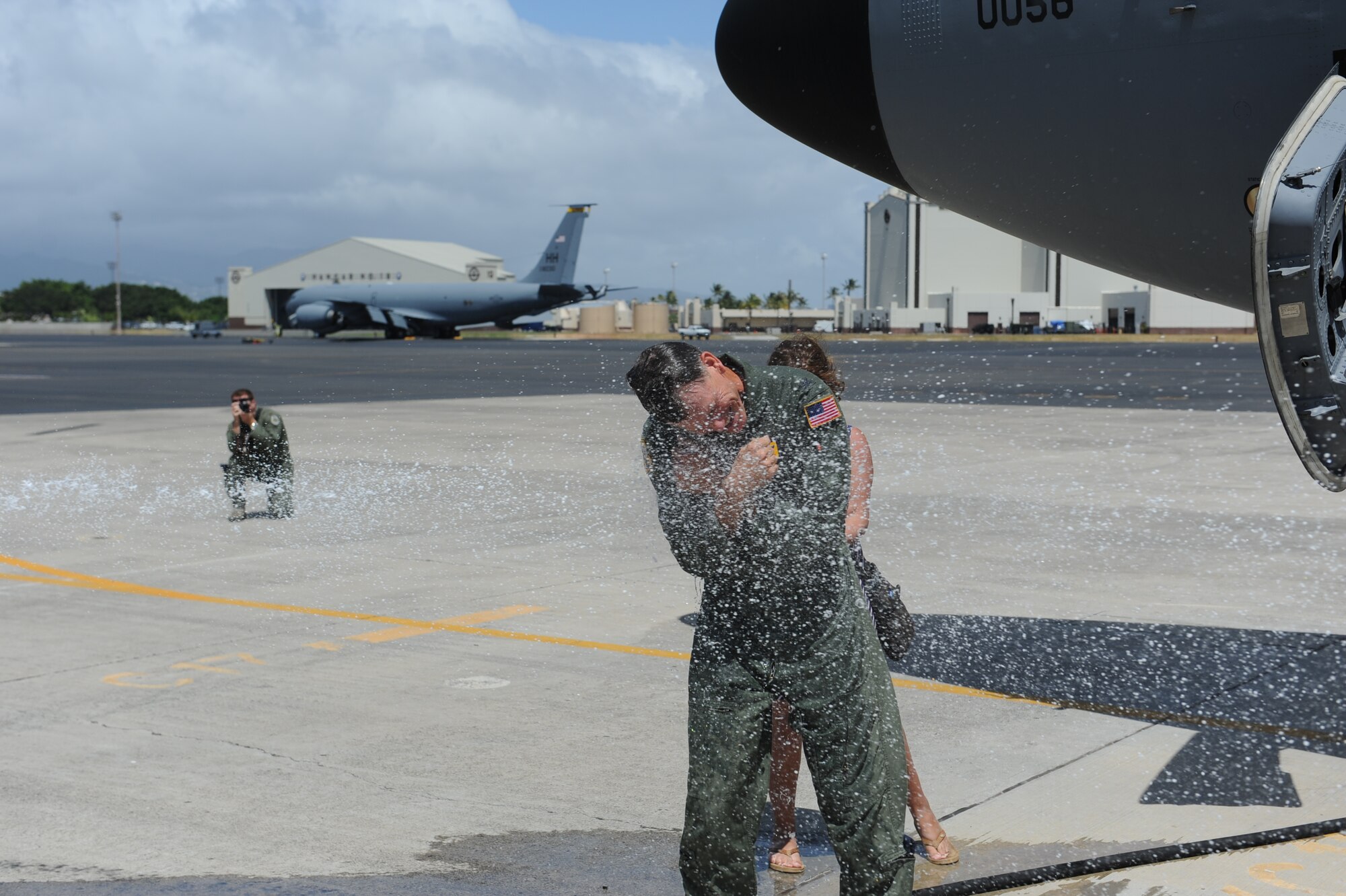 Col. Joe Dague, 15th Wing vice commander, is doused with
water at Joint Base Pearl Harbor-Hickam, Hawaii, to celebrate his "fini
flight" May 23. Dague, a master navigator with more than 2,900 flight hours,
has been the 15th Wing vice commander since June 2010. (U.S. Air Force photo
by Staff Sgt. Nathan Allen)