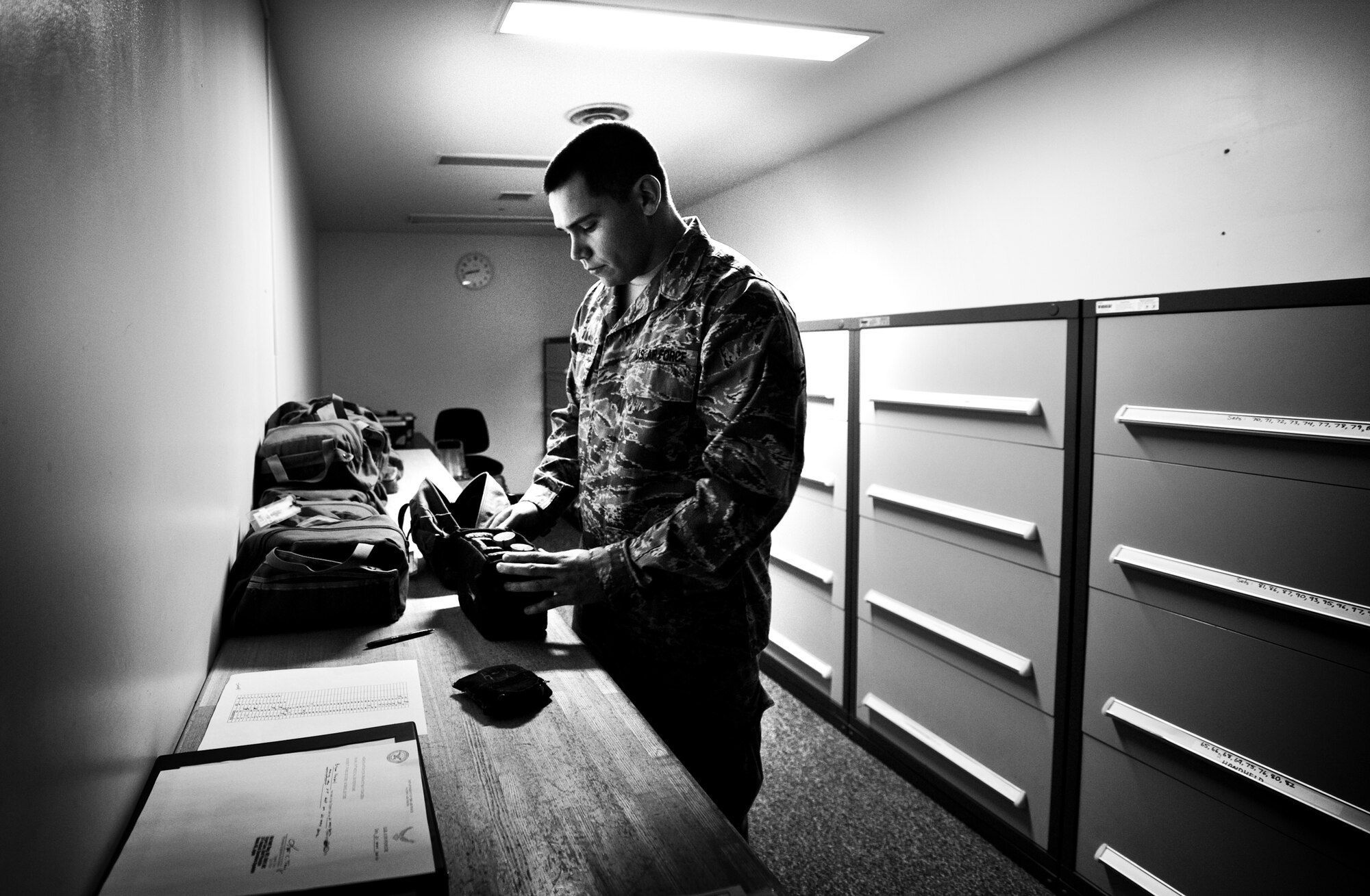 YOKOTA AIR BASE, Japan -- Senior Airman Mark Rocamontes, 374th Operations Support Squadron aircrew flight equipment journeyman, inspects night vision goggles at Yokota Air Base, Japan, May 21, 2012. Night vision goggles are used to assist pilots with aircraft landings conducted in the dark. (U.S. Air Force photo by Airman 1st Class Krystal M. Garrett) 