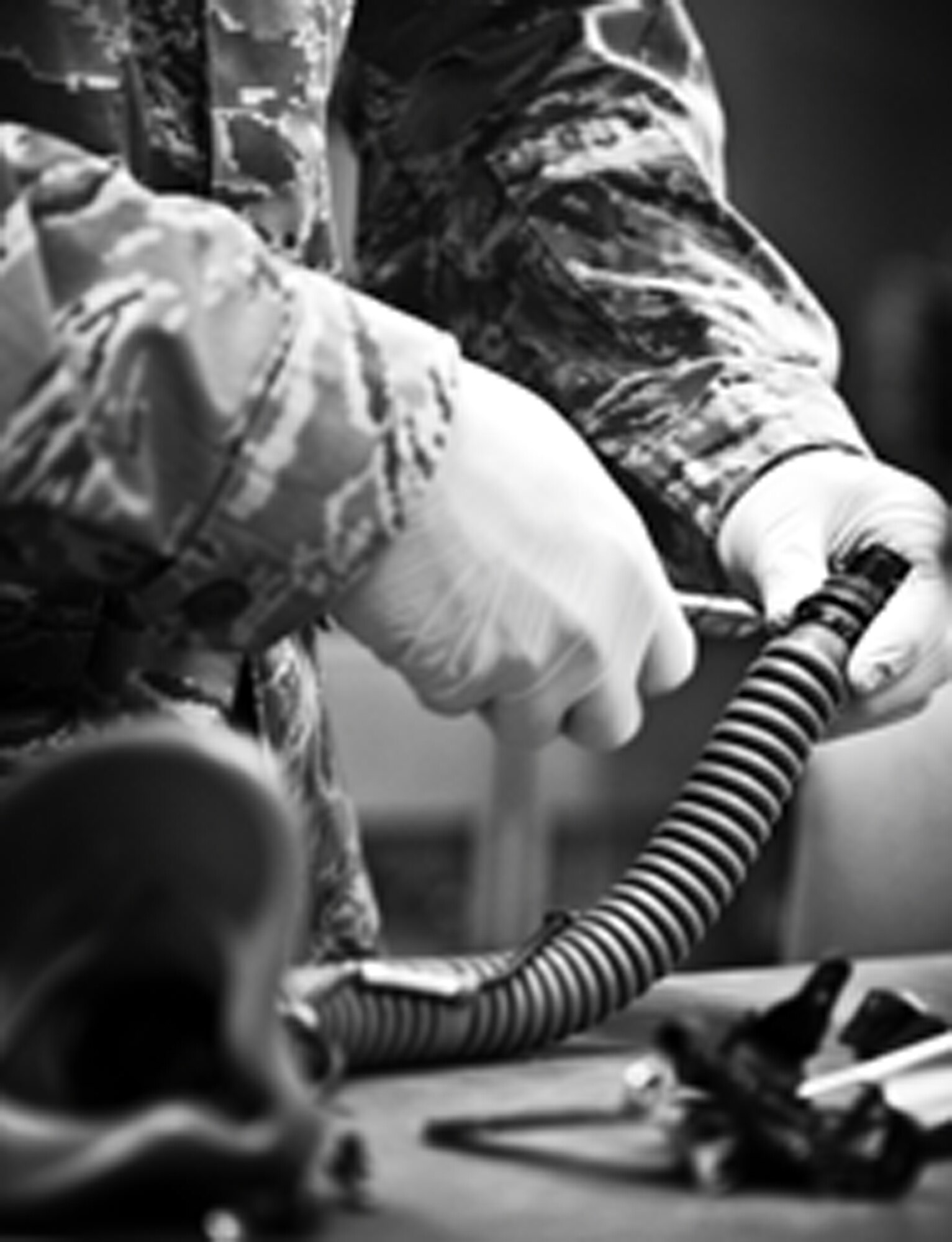 YOKOTA AIR BASE, Japan -- Senior Airman Mark Rocamontes, 374th Operations Support Squadron aircrew flight equipment journeyman, inspects a MBU-12/P mask before sanitizing it at Yokota Air Base, Japan, May 21, 2012. Masks are inspected and sanitized every 30 days. (U.S. Air Force photo by Airman 1st Class Krystal M. Garrett) 