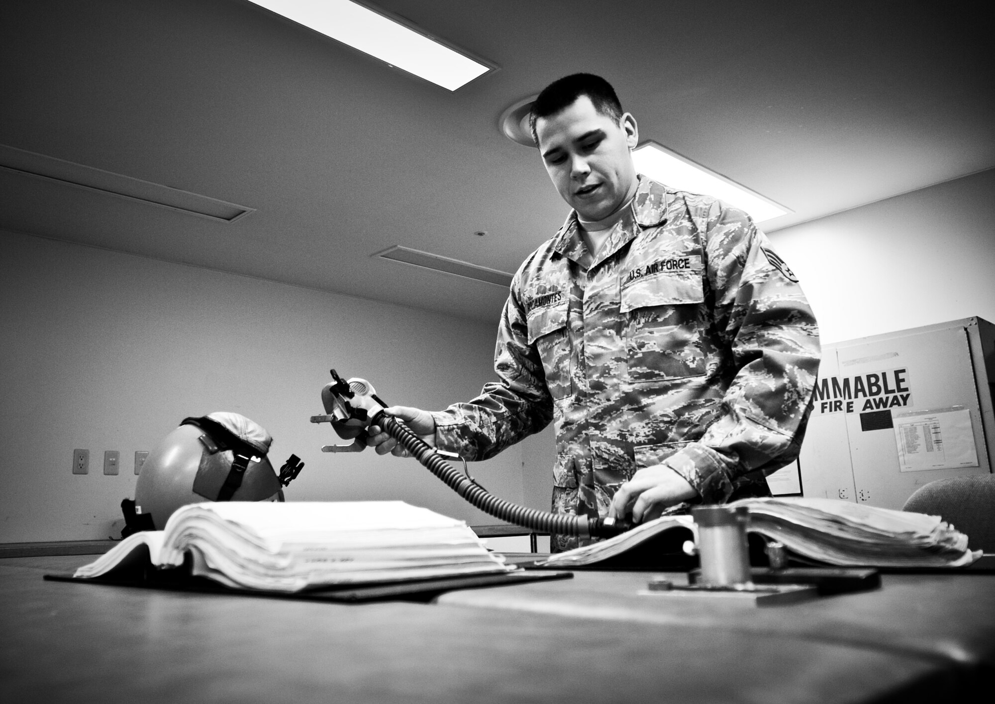 YOKOTA AIR BASE, Japan -- Senior Airman Mark Rocamontes, 374th Operations Support Squadron aircrew flight equipment journeyman, inspects a MBU-12/P mask before sanitizing it at Yokota Air Base, Japan, May 21, 2012. Masks are inspected and sanitized every 30 days. (U.S. Air Force photo by Airman 1st Class Krystal M. Garrett) 