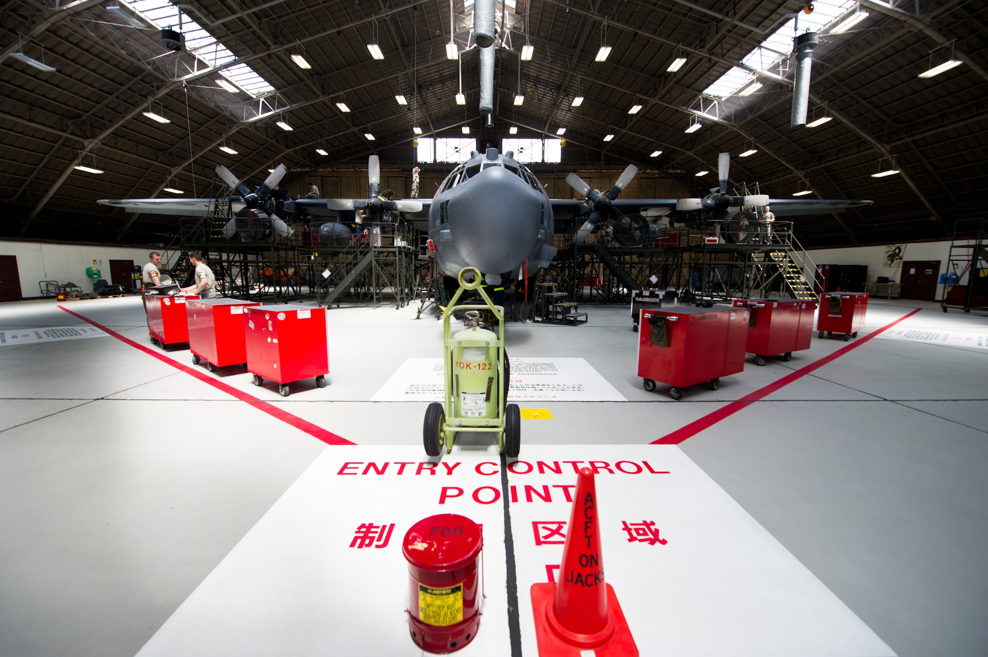 YOKOTA AIR BASE, Japan -- This C-130 Hercules is in the process of an isochronal inspection at Yokota Air Base, Japan, May 14, 2012. The inspection consists of dividing the plane into five sections, allowing Airmen to examine each section individually. During these inspections, aircraft maintainers look for and repair problems in every system, from nose to tail and wing-tip to wing-tip. (U.S Air Force photo by Staff Sgt. Stacy Moless)
