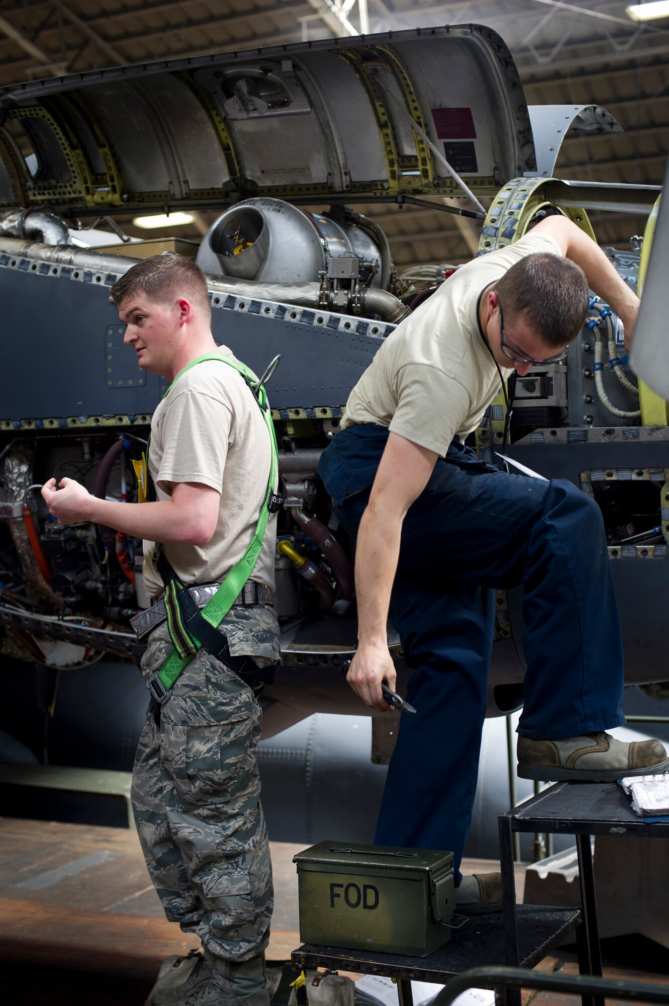 YOKOTA AIR BASE, Japan -- Left to right, Staff Sgt. Matthew McCullough and Airman 1st Class Charles Burton, both from the 374th Maintenance Squadron, perform an isochronal inspection on a C-130 Hercules at Yokota Air Base, Japan, May 14, 2012. Maintainers at Yokota service planes from Yokota Air Base and Kadena Air Base in Okinawa, Japan. (U.S Air Force photo by Staff Sgt. Stacy Moless)