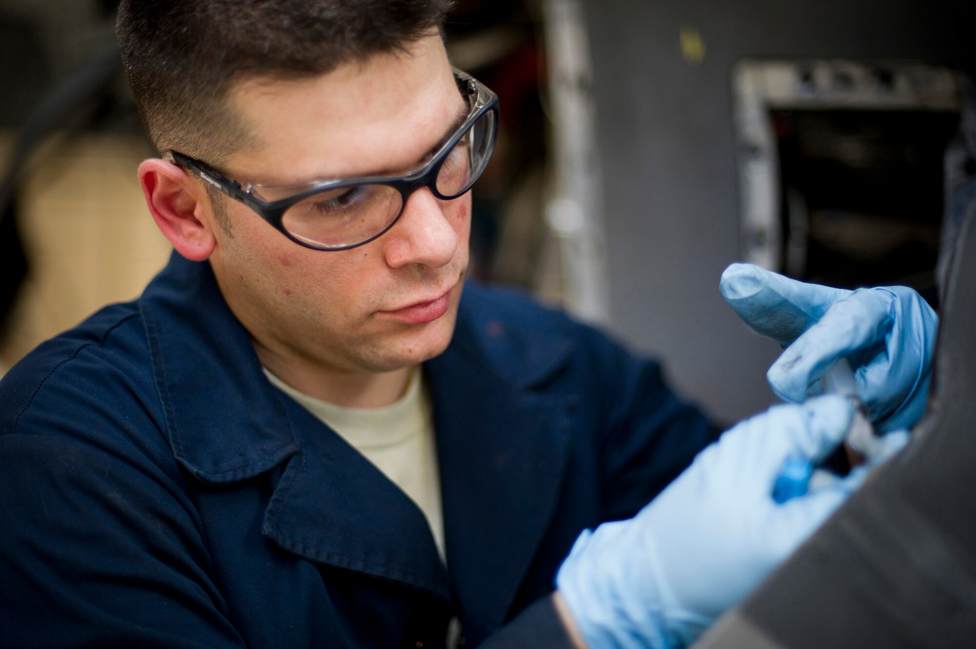 YOKOTA AIR BASE, Japan -- Staff Sgt. Joseph Muscarella, 374th Maintenance Squadron, performs a propeller blade repair during an isochronal inspection on a C-130 Hercules May 14, 2012, at Yokota Air Base, Japan. The inspection consists of dividing the plane into five sections, allowing Airmen to examine each section individually. Between Yokota and Kadena Air Base in Okinawa, Japan, there are more than 20 C-130s that must be inspected every 540 days by maintenance personnel. (U.S Air Force photo by Staff Sgt. Stacy Moless)