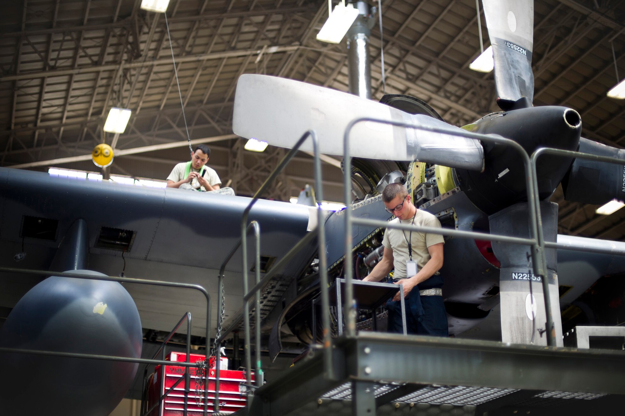 YOKOTA AIR BASE, Japan -- Left to right, Airman 1st Class Roberto Vargas and Airman 1st Class Charles Burton, 374th Maintenance Squadron, are performing an isochronal inspection on a C-130 Hercules at Yokota Air Base, Japan, May 14, 2012. Vargas and Burton perform a wide variety of inspections to ensure the aircraft is mission ready. (U.S Air Force photo by Staff Sgt. Stacy Moless)