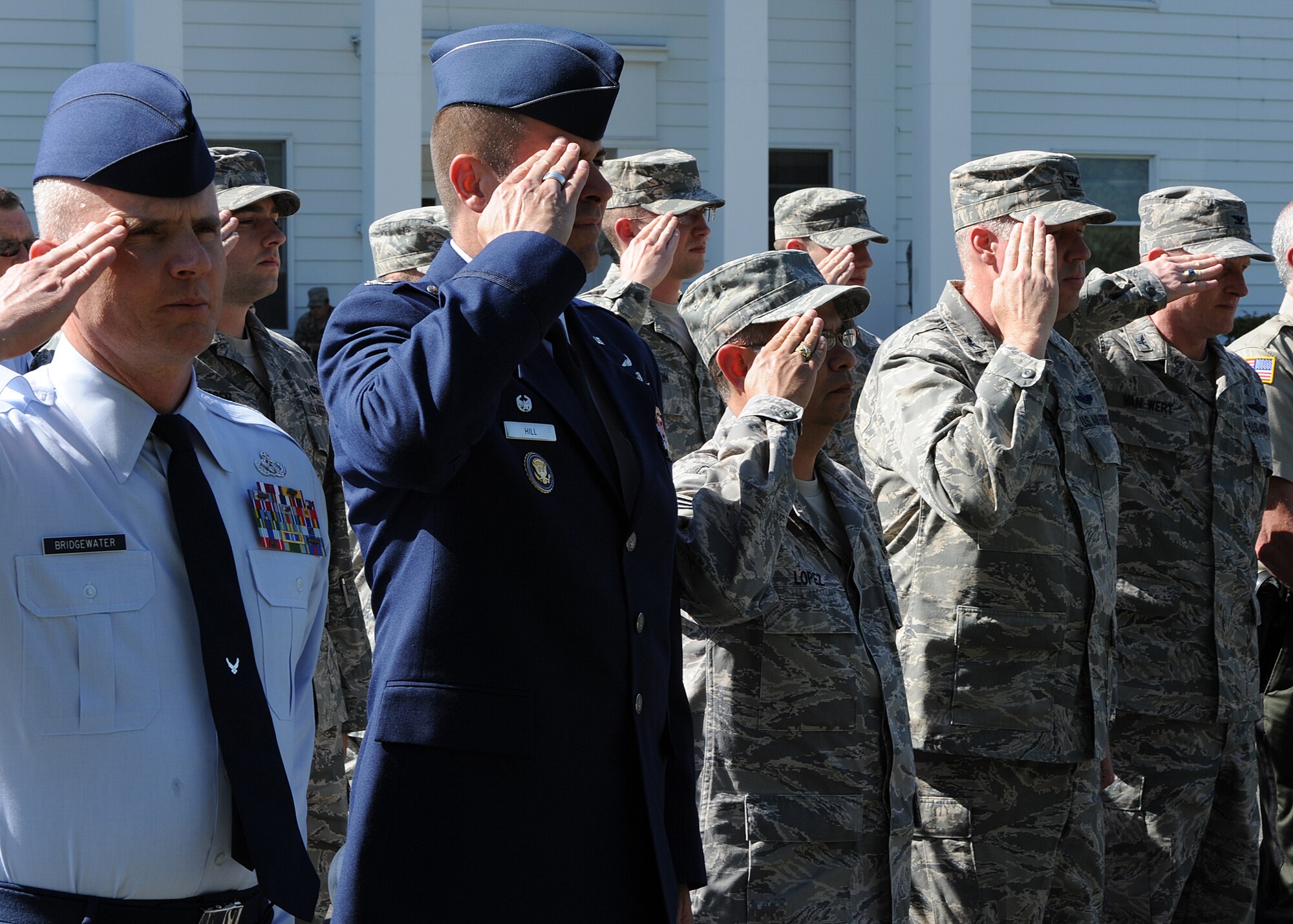 Members of Team Fairchild and local law enforcement officers salute to pay respect during the police week remembrance retreat ceremony at Fairchild Air Force Base, Wash., May 15, 2012. Members of Team Fairchild and local police departments were in attendance to remember officers who lost their lives in the line of duty. (U.S. Air Force photo by Staff Sgt. Michael Means/Released)