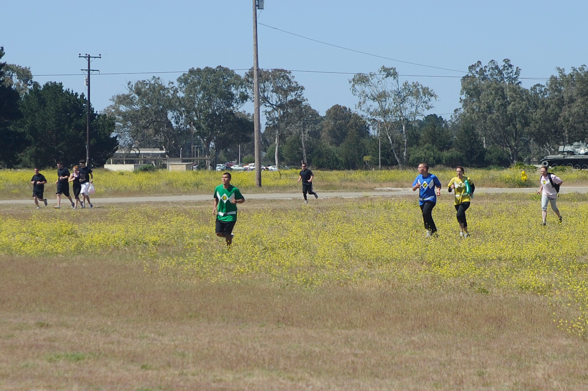 VANDENBERG AIR FORCE BASE, Calif. -- Airmen finish the last stretch of a run during Vandenberg's Run to Survive Safety Competition at the parade grounds here Tuesday, May 22, 2012. The competition had the participants run around to multiple locations on base testing their safety skills and knowledge. (U.S. Air Force photo/Staff Sgt. Andrew Satran)  