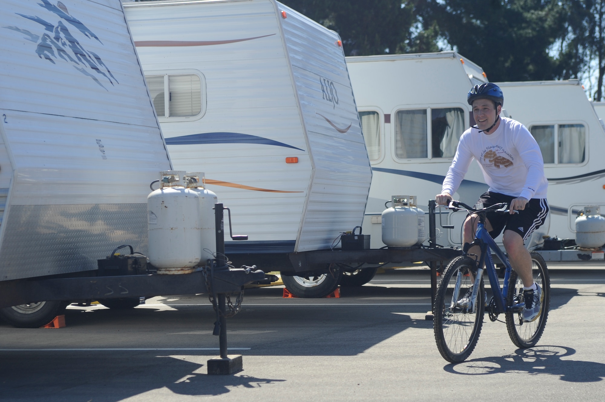VANDENBERG AIR FORCE BASE, Calif. -- A Team V Airmen practices bicycle safety during Vandenberg's Run to Survive Safety Competition at the parade grounds here Tuesday, May 22, 2012. The competition had the participants run around to multiple locations on base testing their safety skills and knowledge. (U.S. Air Force photo/Staff Sgt. Andrew Satran)  