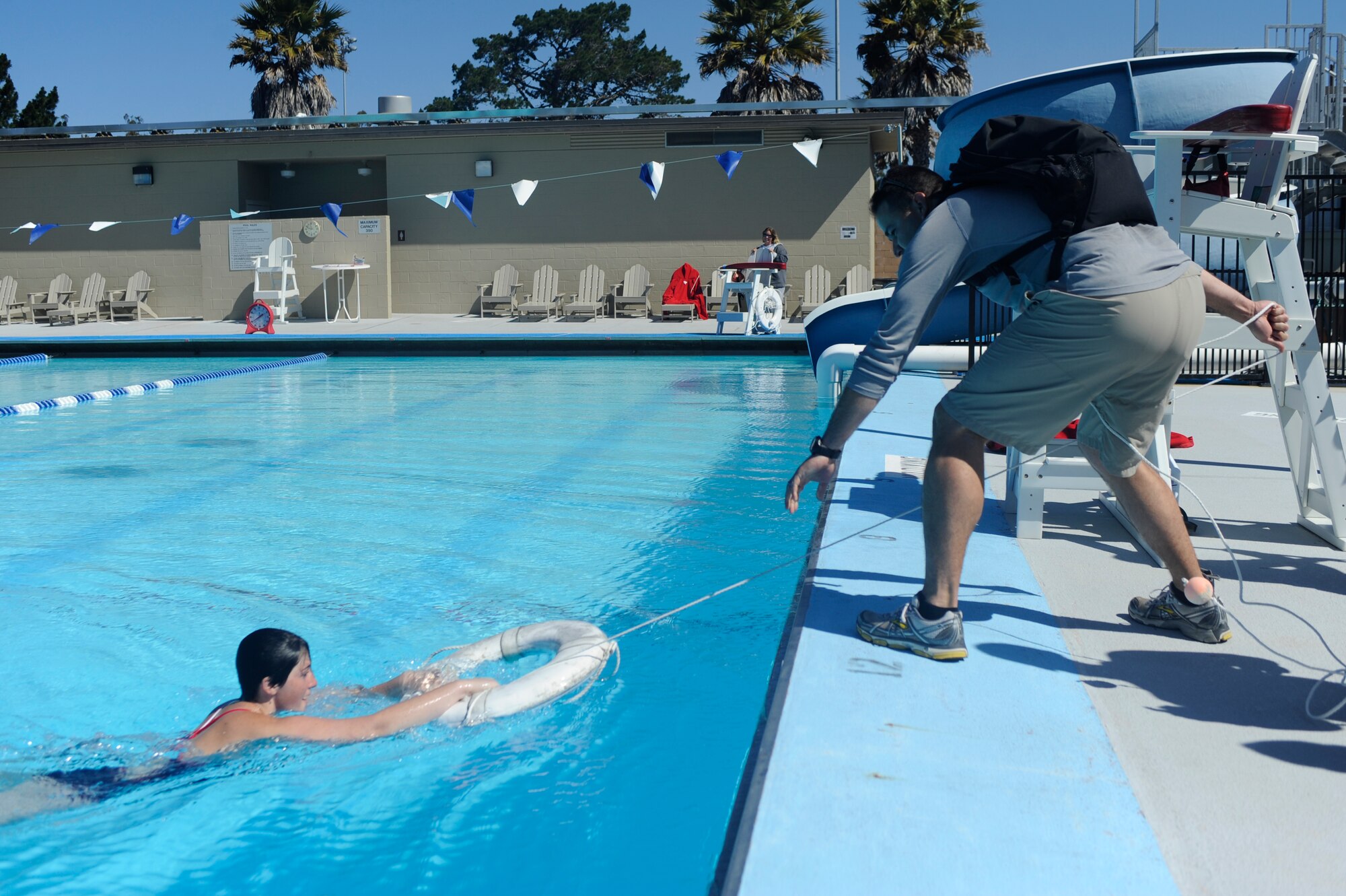 VANDENBERG AIR FORCE BASE, Calif. -- A Team V Airmen rescues a simulated drowning victim during Vandenberg's Run to Survive safety competition at the parade grounds here Tuesday, May 22, 2012. The competition had the participants run around to multiple locations on base testing their safety skills and knowledge. (U.S. Air Force photo/Staff Sgt. Andrew Satran)  