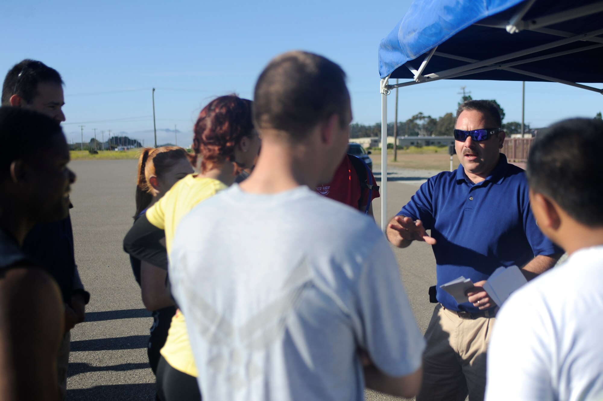 VANDENBERG AIR FORCE BASE, Calif. -- Michael Trudeau, 30th Space Wing Safety Office safety specialist, briefs the rules of Vandenberg's Run to Survive Safety Competition at the parade grounds here Tuesday, May 22, 2012. More than 50 Team V Airmen participated in the base wide event. (U.S. Air Force photo/Staff Sgt. Andrew Satran)  