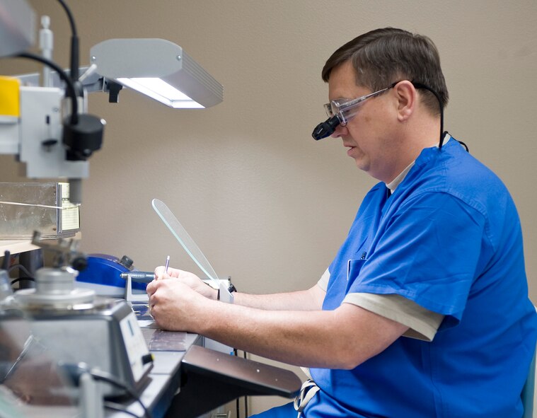 Lt. Col. Ryllis Rousseau, 2nd Dental Squadron dentist, works on a prosthetic in the new dental lab on Barksdale Air Force Base, La., May 22. The new facility has two work stations set up to be used by the dentists in addition to the six stations for the lab technicians. (U.S. Air Force photo/Staff Sgt. Chad Warren)(RELEASED)