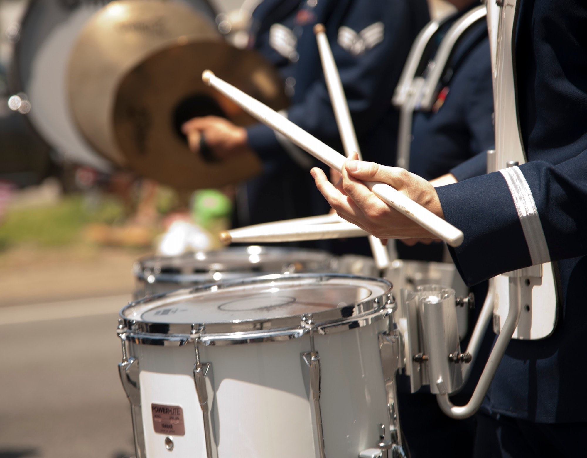 The USAF Band of the Golden West percussion line marches down Torrance Boulevard during the Armed Forces Parade in Torrance, CA Saturday.