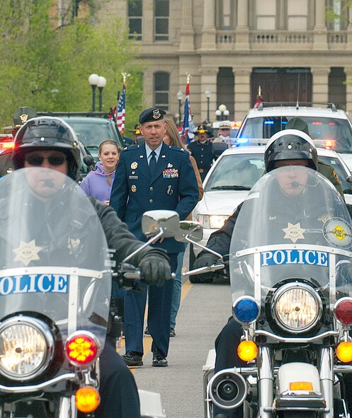Col. Tom Wilcox, 90th Security Forces Group commander, walks with members of other local law enforcement agencies in a parade marking the start of Law Enforcement Week in Cheyenne, Wyo., May 12. Wilcox, along with other F. E. Warren security forces members took part in the parade from the Wyoming State Capitol to the city’s old train depot where exhibits were set up for the public. (U.S. Air Force photo by R.J. Oriez)