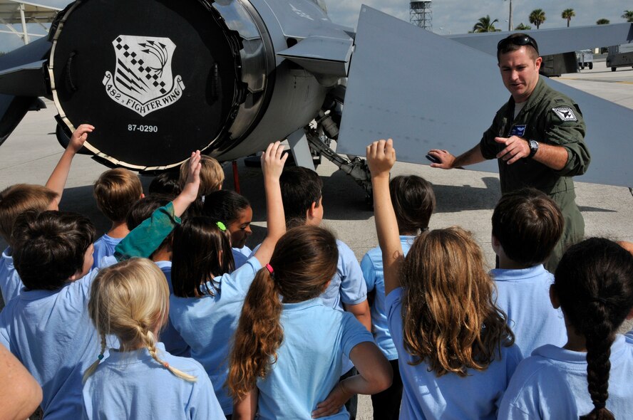 1st Lt. Daniel Lint, 93rd Fighter Pilot, answers questions about the F-16 Fighting Falcon from first and second-grade students from the Atala Montessori School for Creative Expression during a tour of Homestead Air Reserve Base, May 18. (U.S. Air Force photo by Ross Tweten)