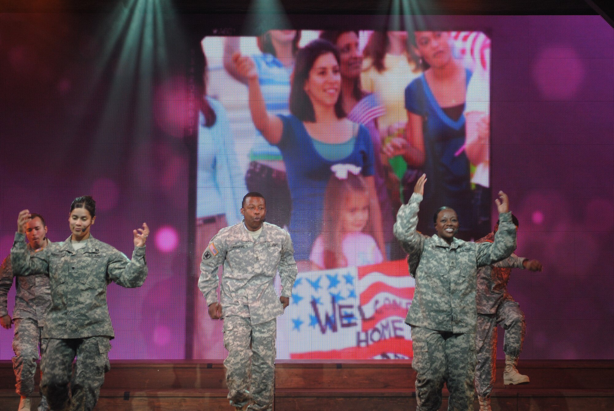 U.S. Army Soldiers rock the house during the 2012 U.S. Army Soldier Show at Joint Base Langley-Eustis, Va., May 15. The 90-minute, all-original show had no slow moments as lights flashed and images of soldiers with their families, protecting the country and participating in other events synced perfectly on a giant screen with their movements and words. (Courtesy photo by Toni Guagenti/Released) 