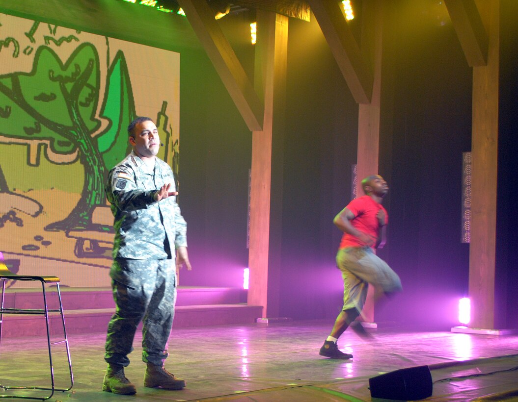 U.S. Army Sgt. Jon Whittle, left, performs a solo during the 2012 U.S. Army Soldier Show at Joint Base Langley-Eustis, Va., May 15. The emotional toll of deployment, and the history of the Army through song and dance rounded out the show. (Courtesy photo by Toni Guagenti/Released)