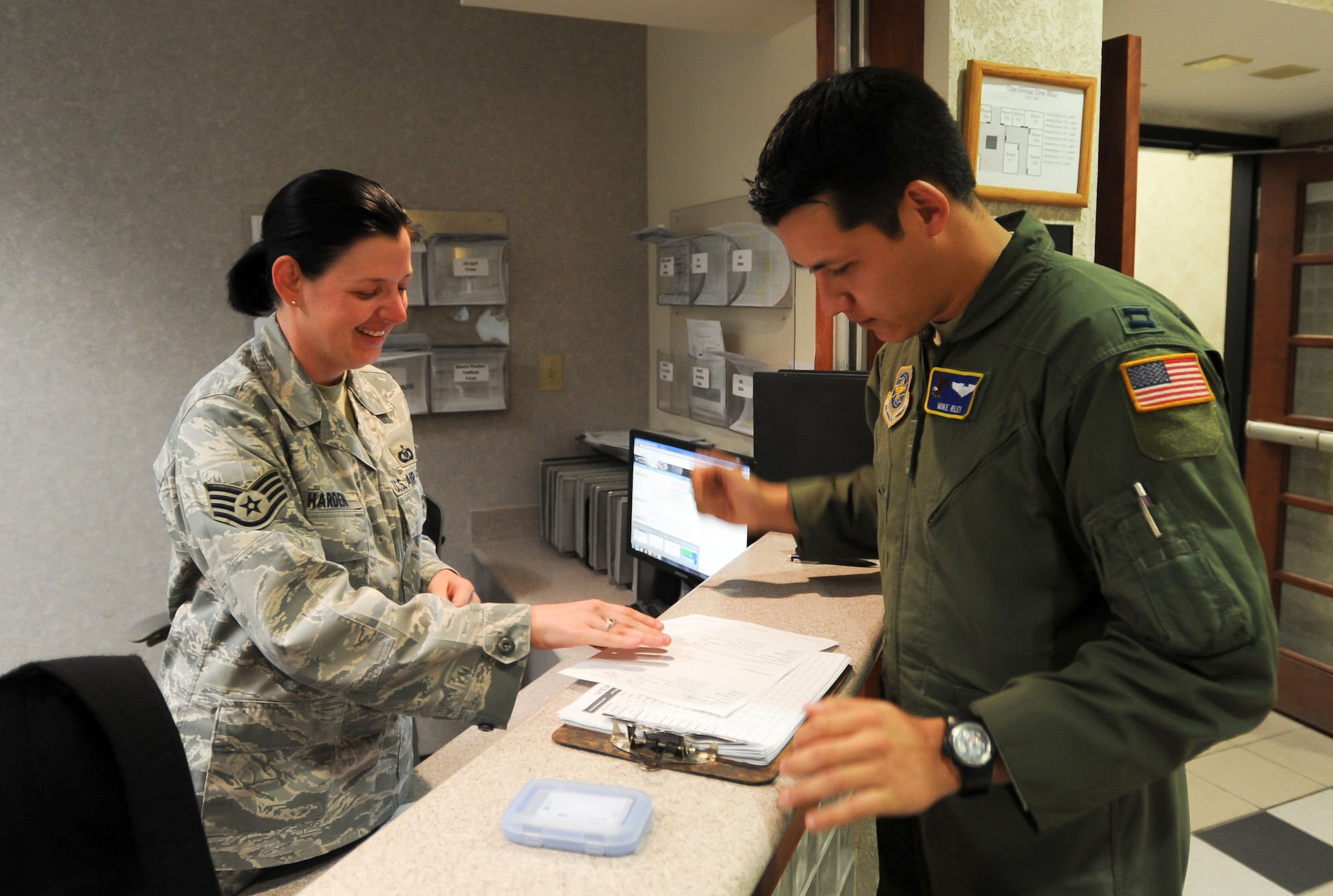 Staff Sgt. Staci Harden, 22nd Operations Support Squadron combined squadron operations center NCO in charge, checks in an aircrew member prior to a flight May 23, 2012, McConnell Air Force Base, Kan. Harden was chosen as the 22nd OSS spotlight performer of the week, May 21 to 25, 2012. (U. S. Air Force photo/Airman 1st Class Laura L. Valentine)