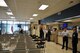 Passenger terminal personnel socialize Monday after a ceremony officially unveiling the remodeled facility. Renovations were made to the layout, electricity, and infrastructure. (U.S. Air Force photo/Airman 1st Class)