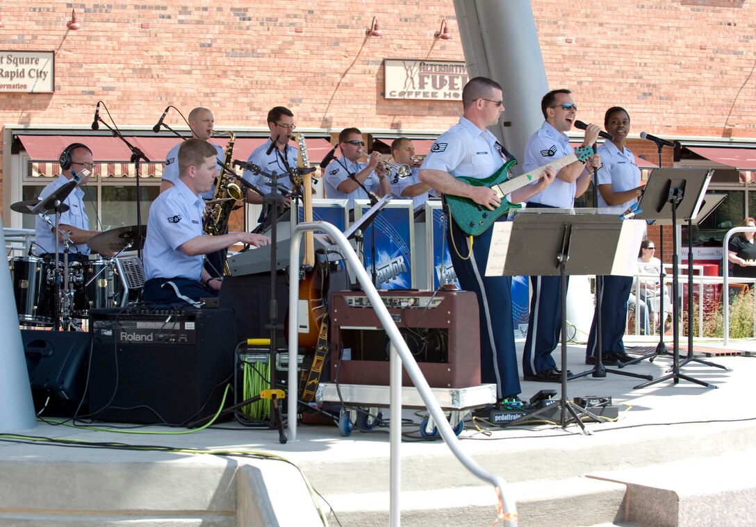 As part of the Ellsworth Air Force Base 70th anniversary celebration, the U.S. Air Force Heartland of America Band’s pop rock ensemble – Raptor - performs at Main Street Square in Rapid City, S.D., May 20, 2012. The free concert was provided in appreciation to Rapid City and the surrounding Black Hills area communities. (U.S. Air Force photo by Staff Sgt. Marc I. Lane/Released)