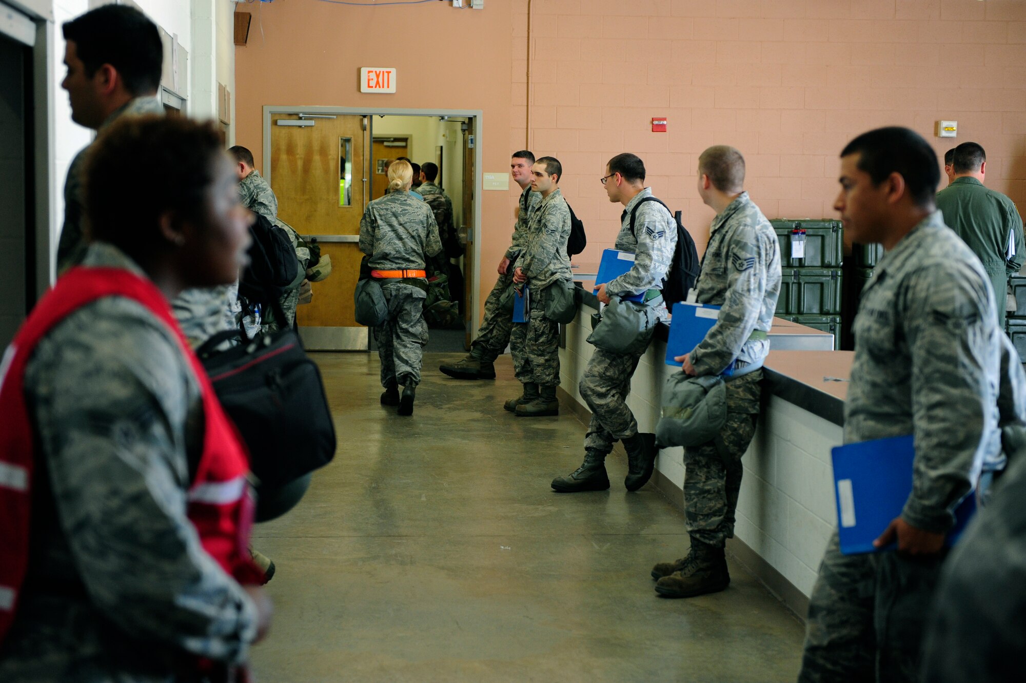 Airmen line up as they prepare to process the line during an Operational Readiness Exercise, Shaw Air Force Base, S.C., May 21 to 22, 2012. Due to the large, continuous volume of Airmen, great effort was placed in the organization and execution of this exercise. An ORE prepares Airmen to meet real-world deployment scenarios with speed, accuracy and confidence. (U.S. Air Force photo by Airman Daniel B. Blackwell/Released)