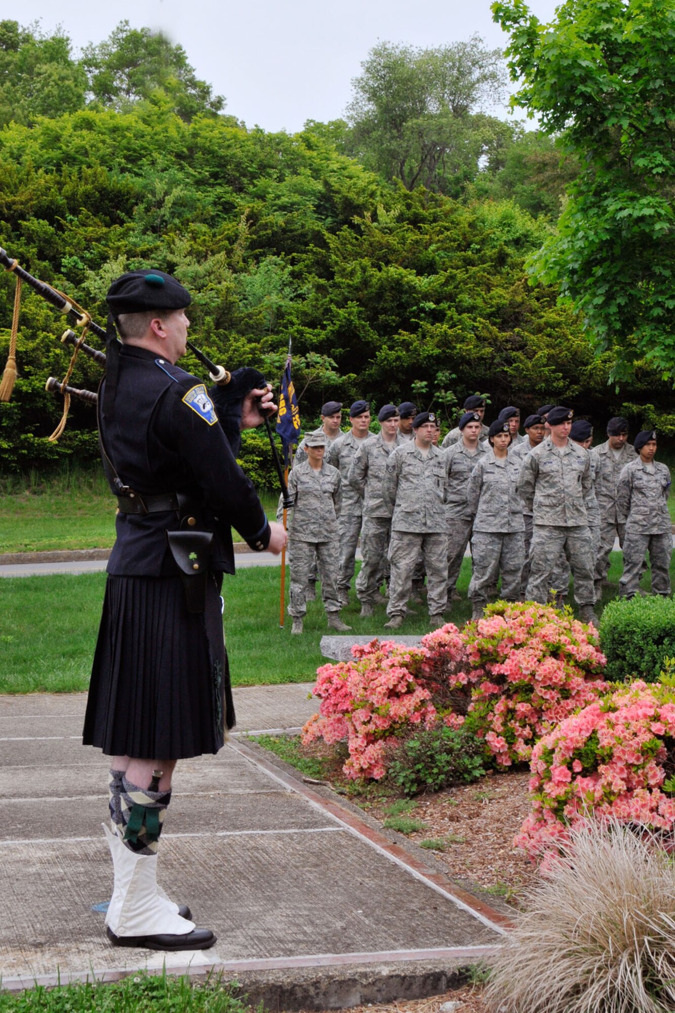 HANSCOM AIR FORCE BASE, Mass.--Joe Cheevers, a pipe major from the Boston Police Gaelic Column of Pipes and Drums, performs during the Police Week retreat ceremony at the POW/MIA Memorial area May 15. (U.S. Air Force photo by Linda LaBonte Britt)