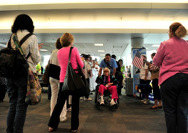 World War II veterans are welcomed to Washinton D.C. by active duty members May 21 before they board a bus to visit the memorials sponsored by the Greater St Louis Honor Flight program.  (U.S. Air Force photograph/ Staff Sgt. Stephenie Wade)