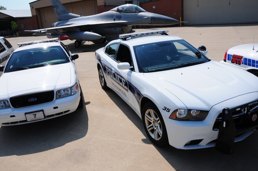 Squad cars from local law enforcement sit in front of an F-16C at the 180th Fighter Wing, May 5, 2012 as part of the Lucas County annual Memorial Day holiday “Click it or Ticket” campaign. (U.S. Air Force photo by Senior Airman Amber Williams)