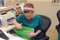 Jordan Polombo, 902nd Force Support Squadron veterinary clinic administration clerk, files pet records May 21 at the Joint Base San Antonio-Randolph veterinary clinic.  (U.S. Air Force photo by Rich McFadden) 