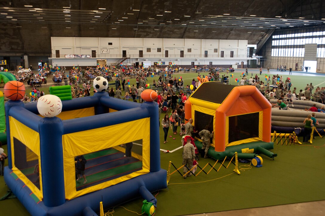 A wide array of activities, events, entertainment and free food were available for Airmen and their families during the 70th Anniversary Kick-Off Party event in the Pride Hangar on Ellsworth Air Force Base, S.D., May 18, 2012. Ellsworth celebrated its 70th Anniversary with a weekend of events that included the Kick-Off Party, a golf tournament, a Heritage Day event at the South Dakota Air and Space Museum, a formal celebration dinner, and a free band concert by the U.S. Air Force Heartland of America Band’s “Raptor”. (U.S. Air Force photo by Airman 1st Class Zachary Hada/Released)