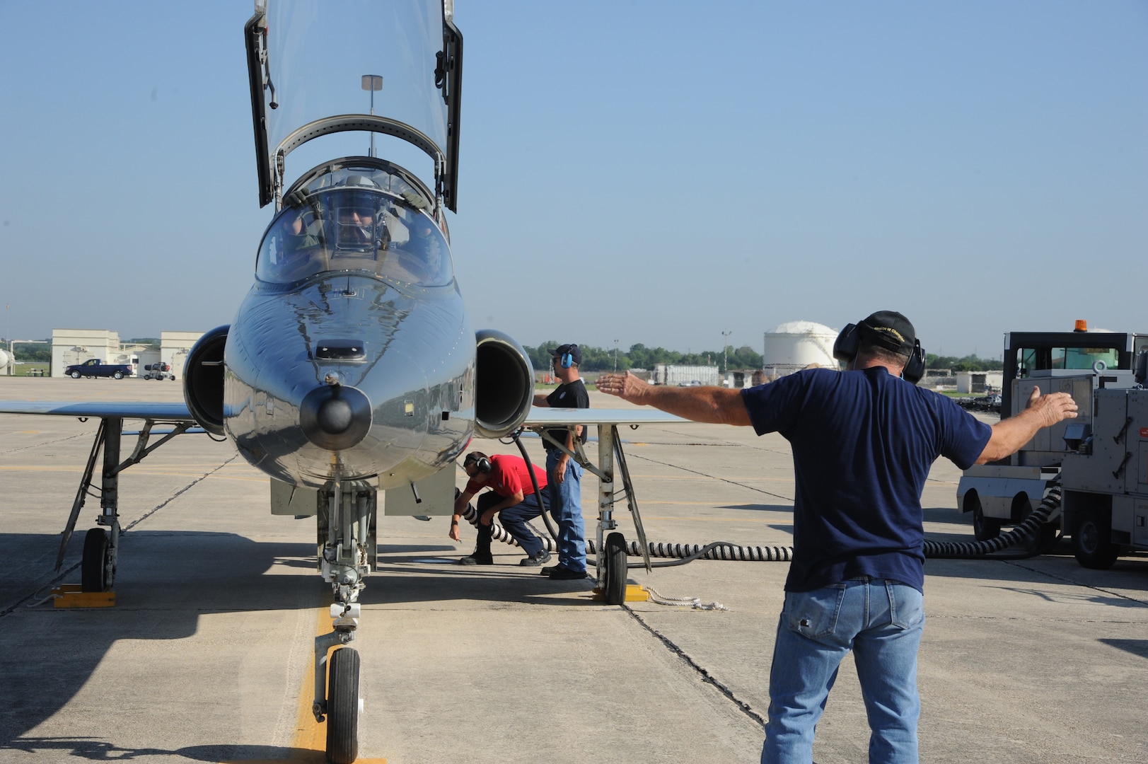 Keith Barnes (right), Jack Pagel (center) and Chuck Cornwall, 571st Aircraft Maintenance Squadron contractors, perform final checks to the T-38 Talon prior to Lt. Col. Ripley Woodard, 415th Flight Test Flight commander, taking off from Joint Base San Antonio-Randolph, Texas May 17. The T-38 is being returned to Sheppard Air Force Base, Texas, after being modified by the 571st here. (U.S. Air Force photo by Rich McFadden) 